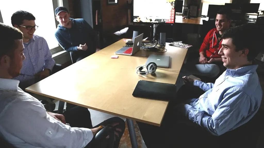 A group of diverse entrepreneurs collaborating on a project
